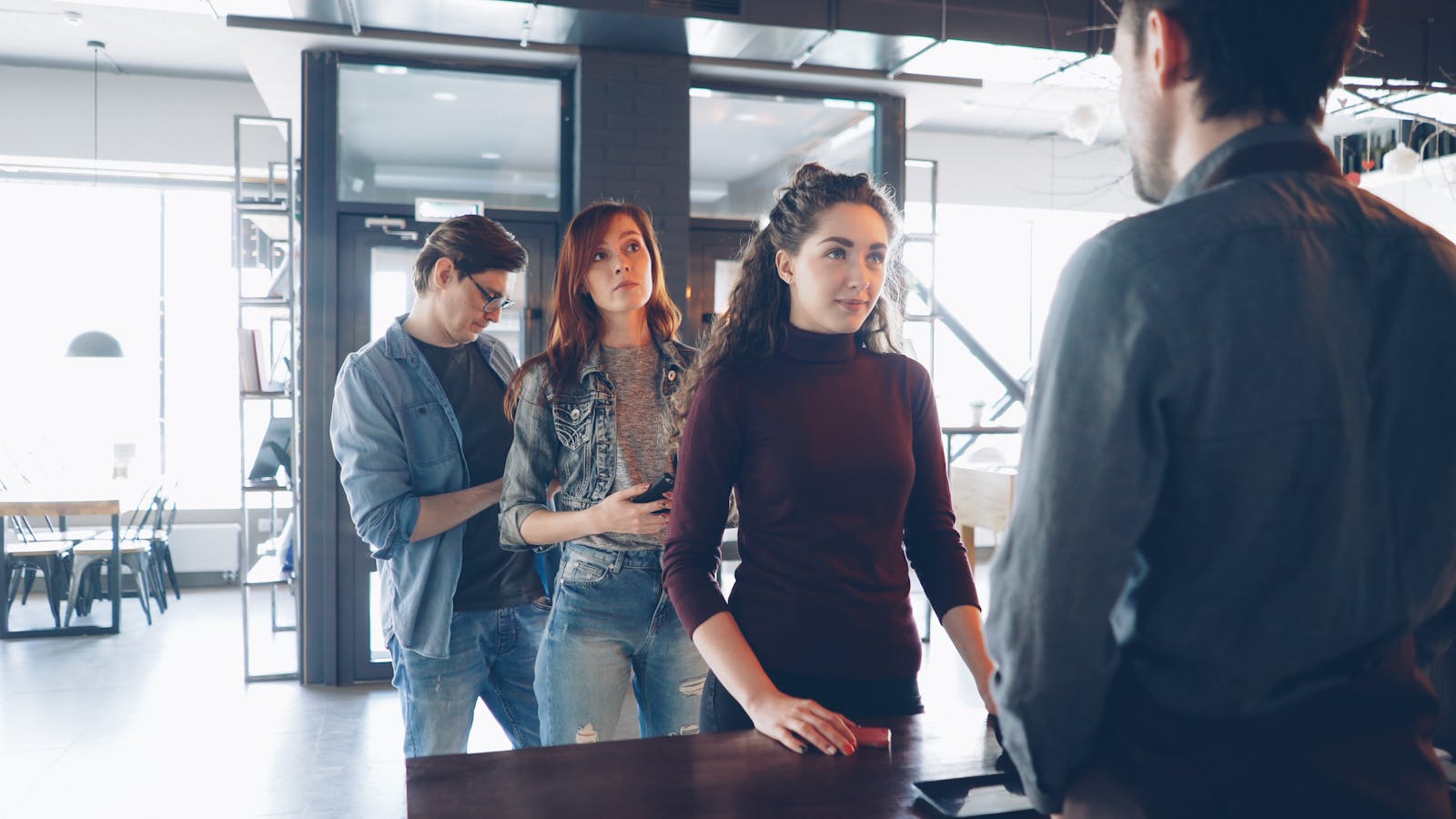 Customers at the counter of a small business